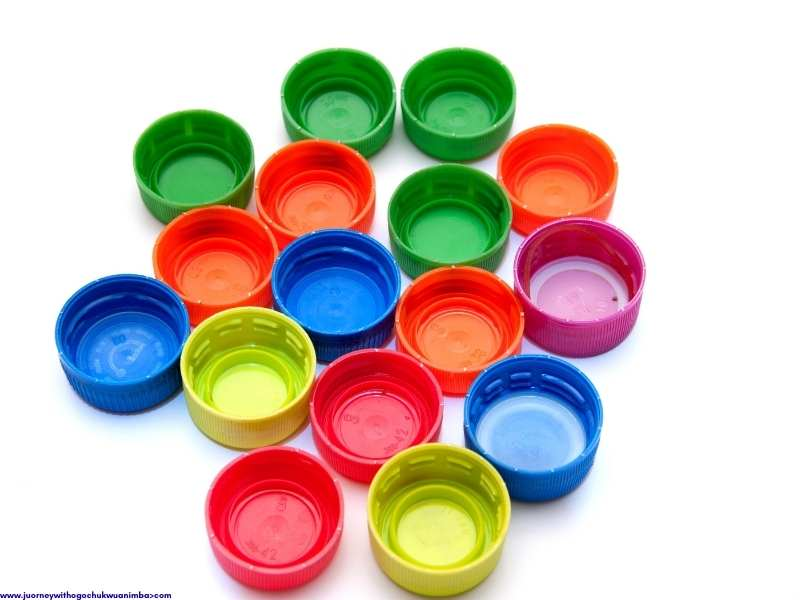 different colors of bottle cap for 27 Easy Kids Crafts with Recycled Materials (Turn Trash into Treasure)