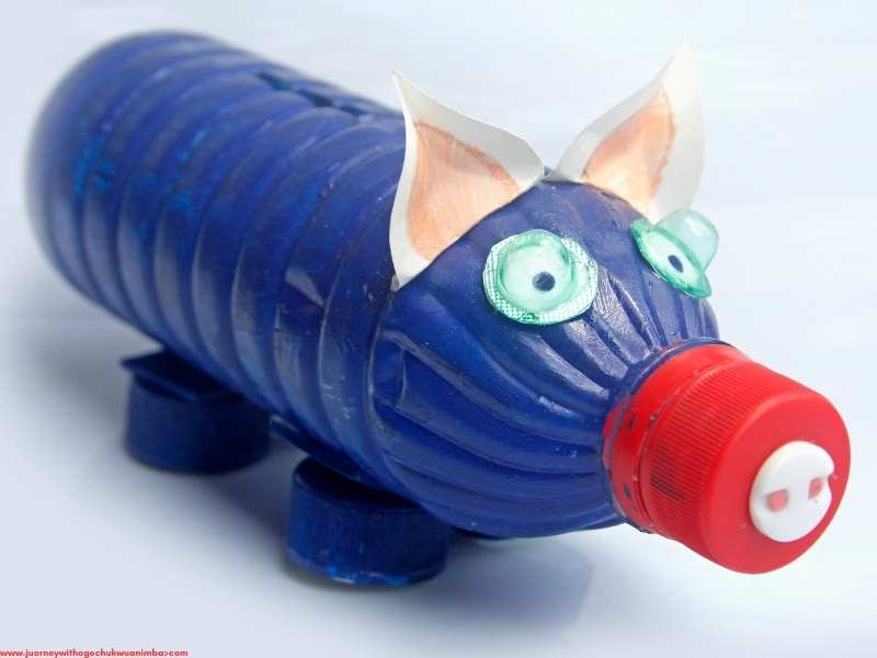 blue and red Plastic Bottle Piggy Bank for 27 Easy Kids Crafts with Recycled Materials (Turn Trash into Treasure)