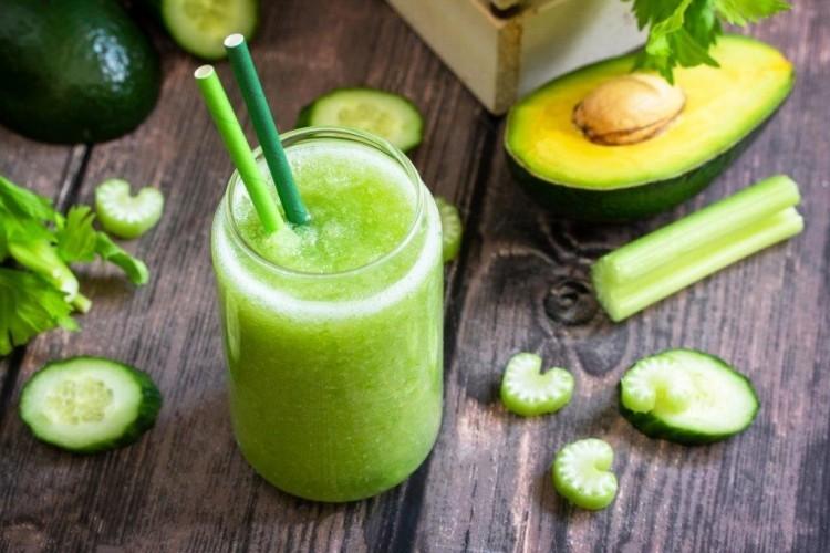 Creamy avocado and cucumber smoothie with lime and mint in a chilled glass